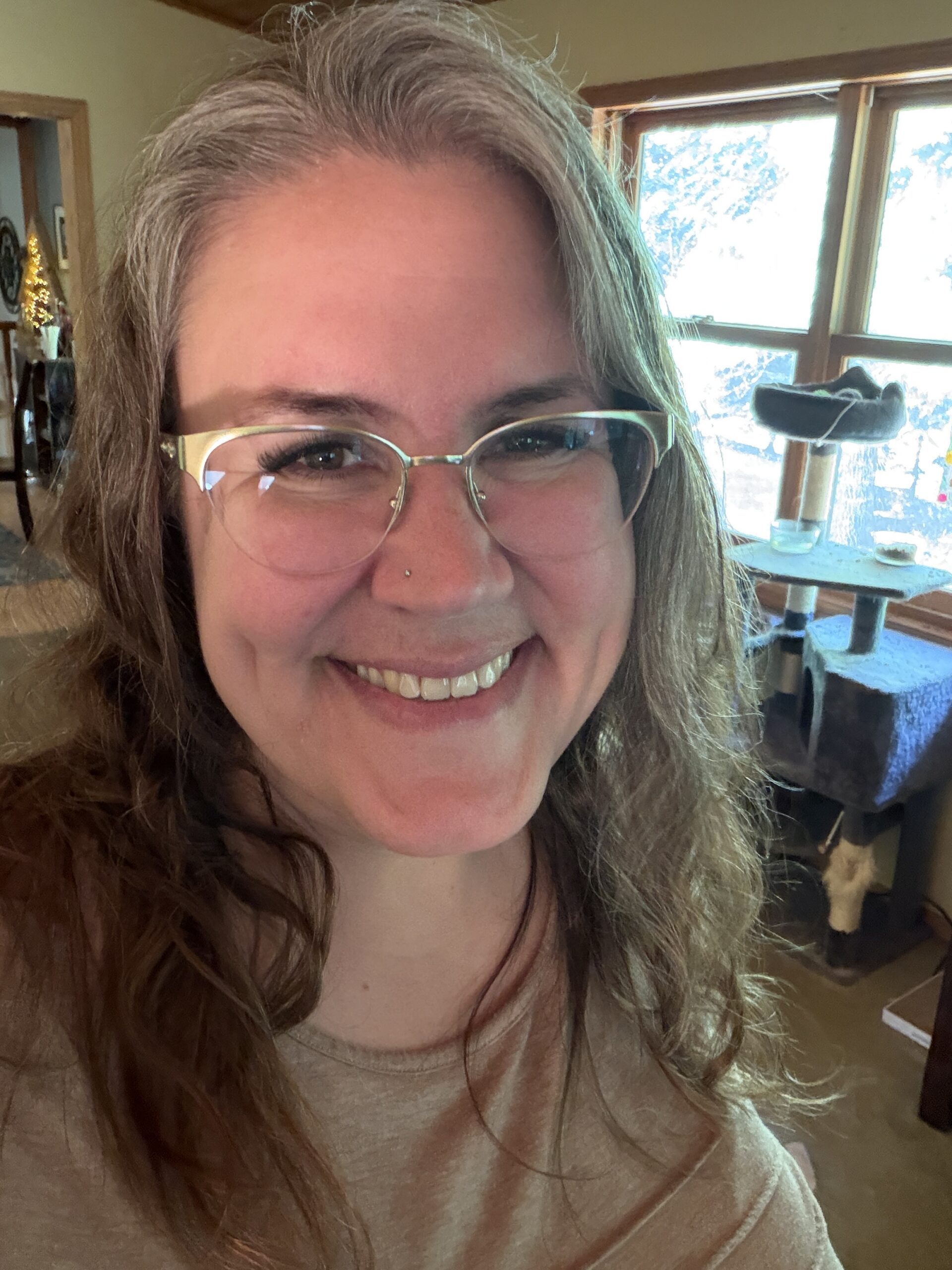 Picture of Kendie smiling at the camera as she thinks about travel planning